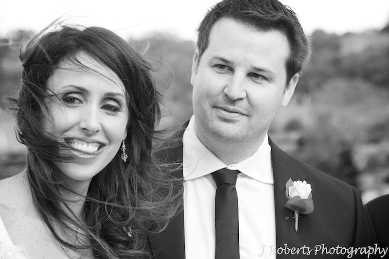 Bride and groom all smiles during wedding ceremony - wedding photography sydney